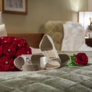 wedding bouquet on bed