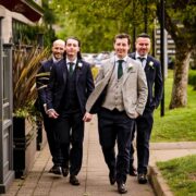 Guests enjoying the lush garden walkway, surrounded by greenery, leading to hotel reception, ideal for special events.