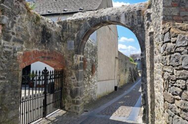 Charming historic stone archway and cobbled path