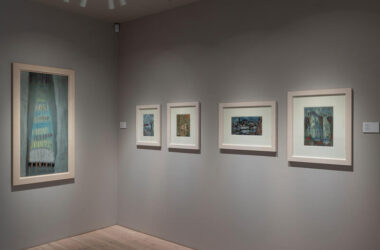 Art gallery with framed paintings and soft lighting for a tranquil hotel experience.
