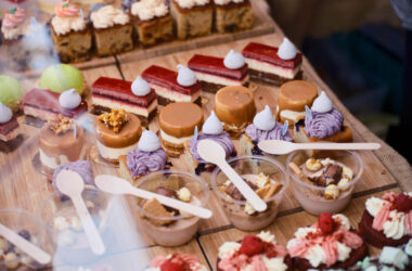 Luxurious dessert spread featuring cakes, mousses, and tarts at a hotel restaurant, perfect for indulgence.