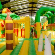 Vibrant indoor inflatable playground with jungle theme for family fun at the hotel.