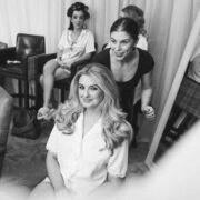Guests enjoying hotel spa salon with hair styling services, featuring luxurious chairs and professional staff. Relaxed atmosphere.